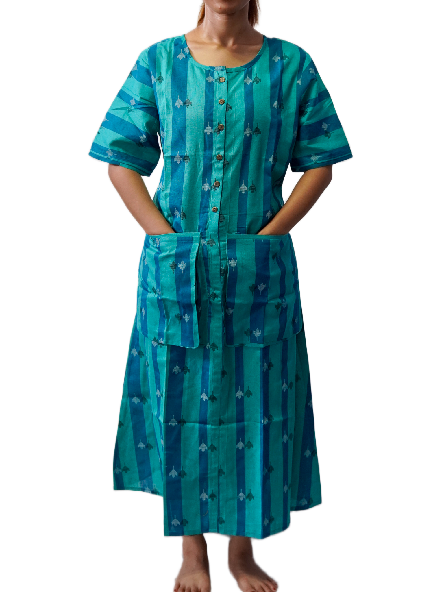 Woman wearing a teal dress with a pattern on a white background