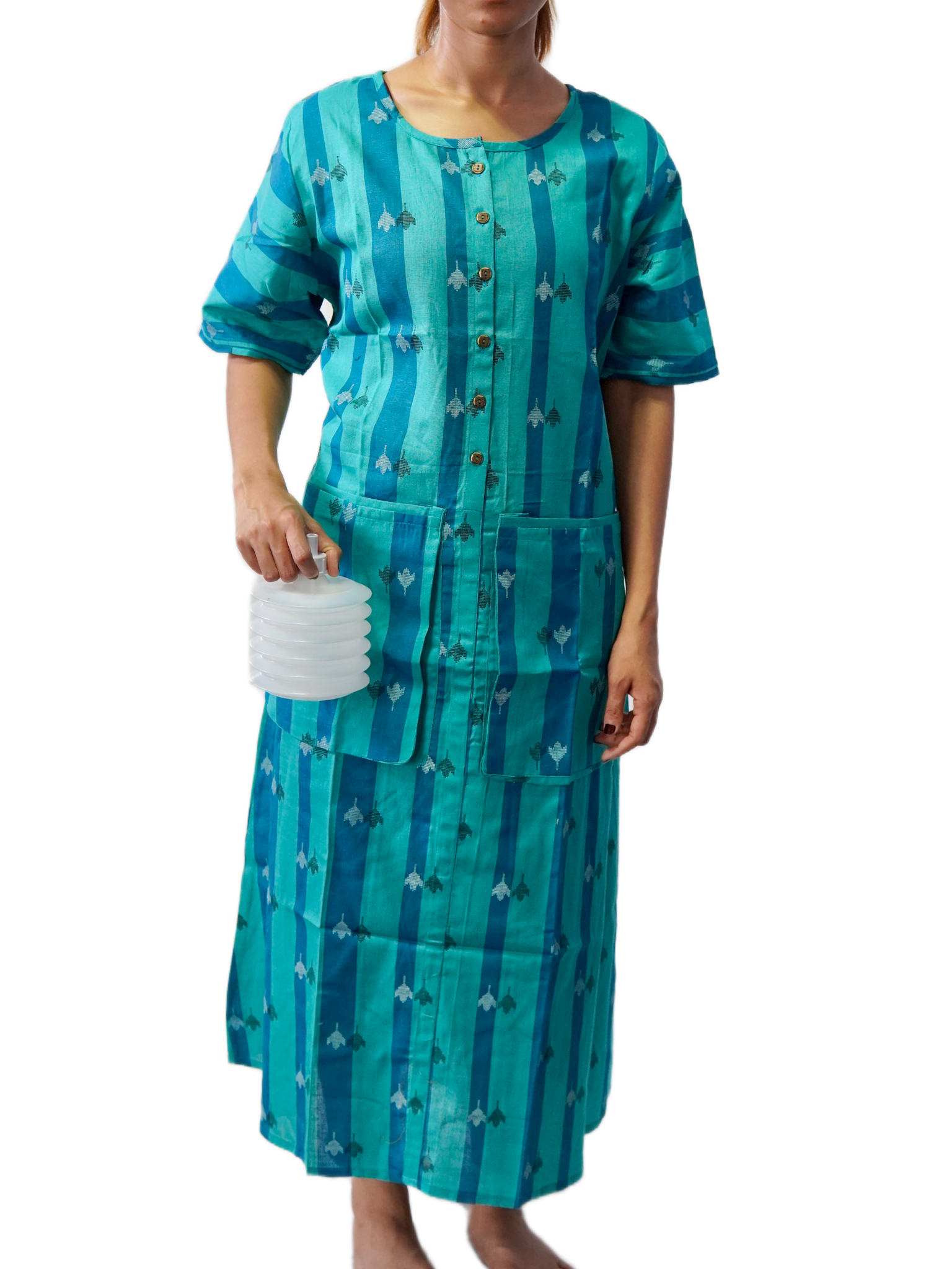 Woman wearing a teal dress with a pattern, holding a drain tube on a white background