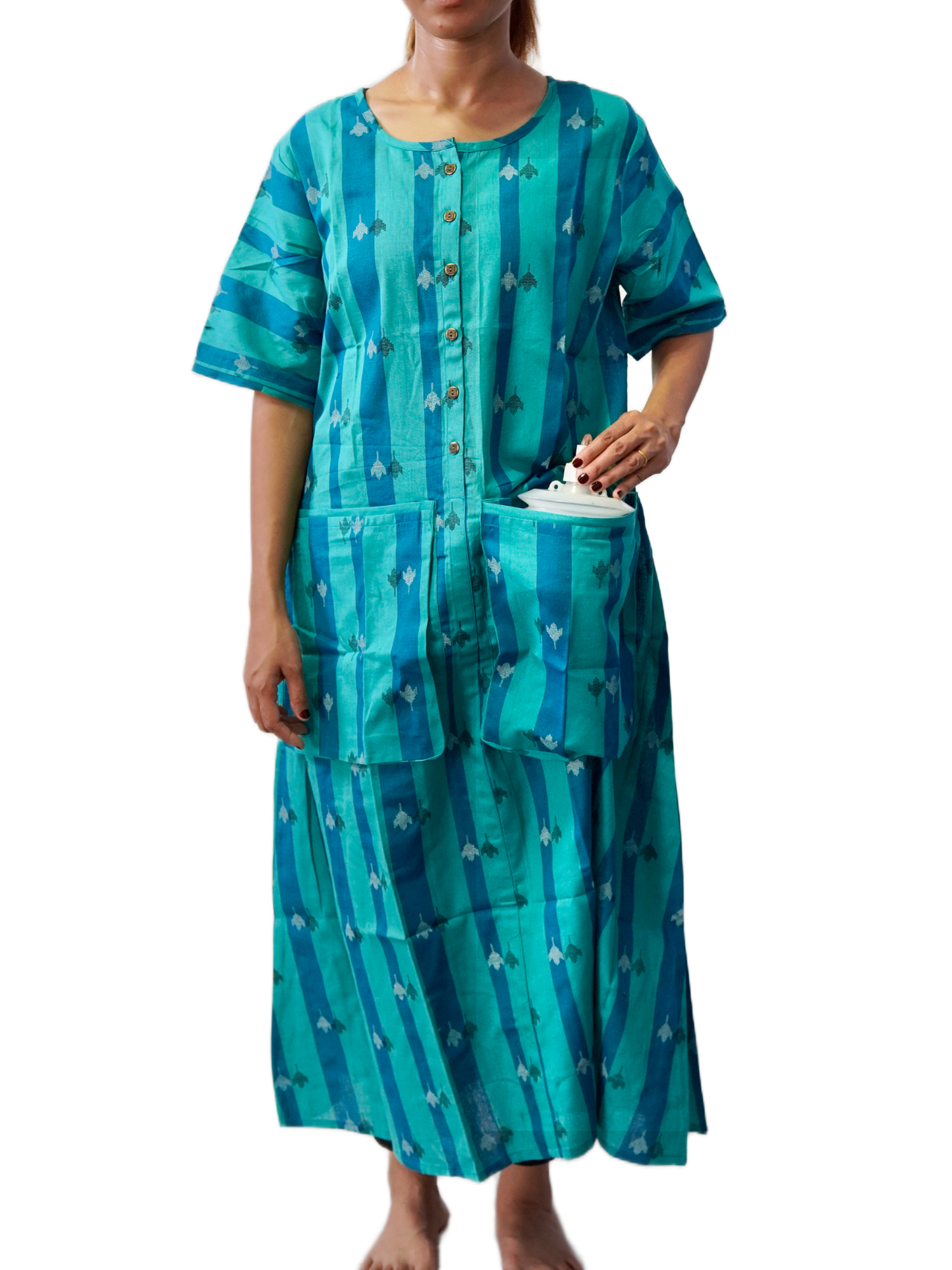 Woman wearing a teal patterned dress with a white background
