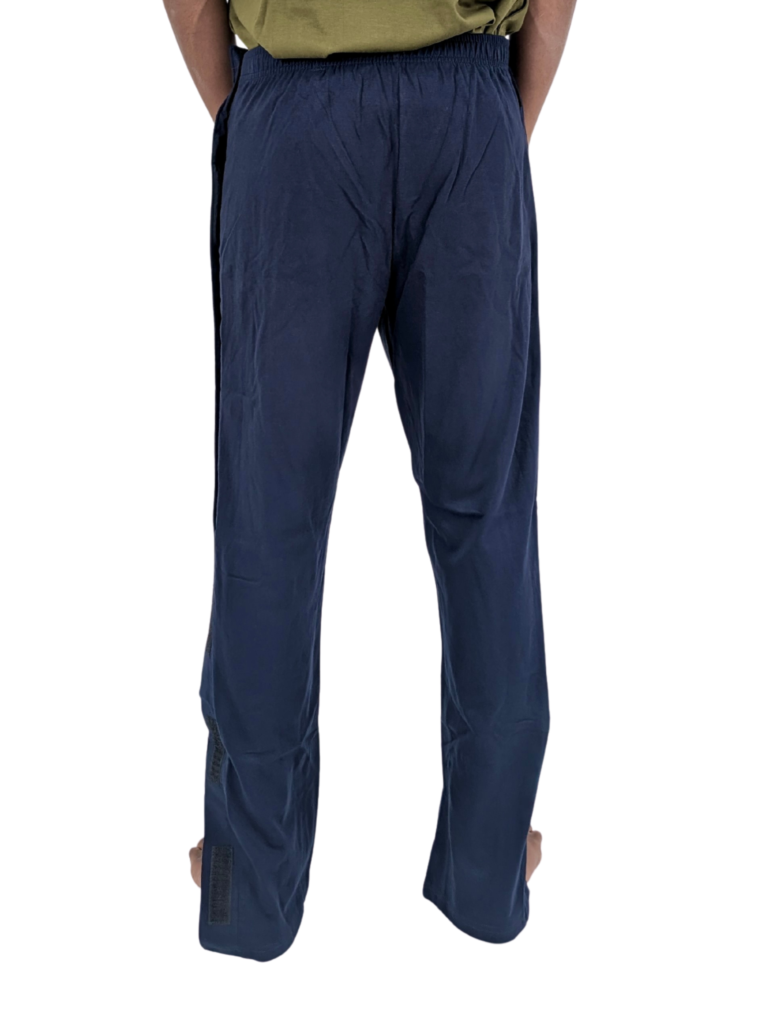 Navy blue pants worn by a person on a white background